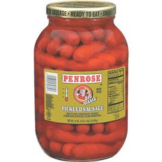 an open jar of pickled sausages on a white background with the label penrose