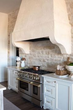 a kitchen with an oven, stove and counter tops in it's center island