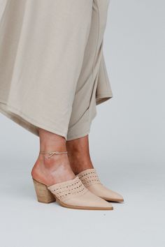 These timeless mules are the perfect touch to any outfit, the Downtown Days Chunky Heel Mule is a must - have for every boho gal! From shopping days to a getaway you'll want to take them everywhere becasue they feature: Pretty vegan leather woven fabric along the top So good slip - on mule style Cute pointed toe detail Perfect 3" thick heel *Due to lighting and differences in monitors, actual colors may vary slightly from what appears online. Approximate measurements are as follows: Width: 3 1/2 Chic Pointed Toe Summer Clogs, Beige Pointed Toe Mules For Summer, Summer Beige Pointed Toe Mules, Bohemian Heels For Spring Vacation, Beige Slip-on Mules For Spring, Beige Closed Toe Mules For Spring, Beige Closed-toe Mules For Spring, Bohemian Block Heel Sandals For Spring, Elegant Beige Mules For Vacation