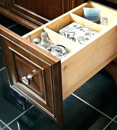 an open drawer in the middle of a kitchen counter