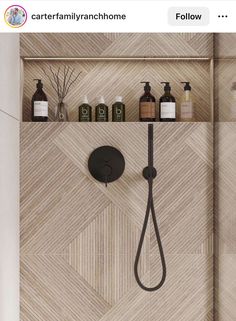 the shower head is connected to two shelves with soaps and lotions