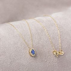 "Sapphire represents commitment in love. Our oval cut sapphire necklace surrounded by 14k solid gold diamonds is an elegant jewel for you and your loved ones with its elegant design. Time to pamper yourself and your loved ones. The color of those born in September is the color of sapphire. Our ring compatible with our necklace: https://queenjewelryturkey.etsy.com/listing/1562024493/oval-sapphire-ringreal-diamond-14k-solid?utm_source=Copy&utm_medium=ListingManager&utm_campaign=Share&utm_term=so.l Gift Sapphire Diamond Cut Necklace, Sapphire Diamond Necklace Fine Jewelry Gift, Sapphire Diamond Necklace As A Fine Jewelry Gift, Sapphire Diamond Necklace As A Gift, Sapphire Diamond Pendant Necklace For Gift, Sapphire Diamond Necklace For Gift, Elegant Sapphire Diamond Necklace For Gift, Elegant Sapphire Birthstone Necklace For Anniversary, Yellow Gold Sapphire Necklace For Anniversary