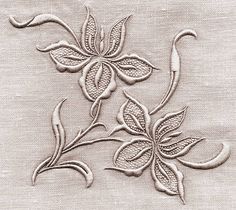 an embroidered design with leaves on it