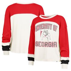 Capture classic Georgia Bulldogs style with this '47 Double Header Curve Raglan Long Sleeve T-Shirt. Featuring distressed team graphics printed across the chest, this tee exudes a vintage-inspired charm that's perfect for game day or any casual occasion. Plus, the raglan sleeves provide greater freedom of movement in the shoulders and arms, making it a comfortable choice for all-day wear. Game Day Varsity Pre-shrunk Top, Varsity Tops For Game Day, University Red Team Spirit Top With Graphic Print, Varsity Team-colored Tops For Game Day, Varsity Pre-shrunk Team-colored Tops, Collegiate Cotton Sweatshirt With Team Logo, Varsity Tops With Team Name For Fan Gear, Varsity Logo Print Top For Game Day, University Red Tops With Graphic Print For Team Spirit