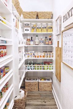 an organized pantry with white shelving and wicker baskets