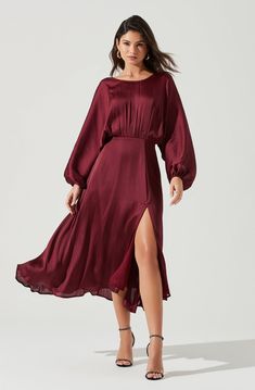 Love stories start here. This gorgeous satin-finish dress features a draped silhouette with long dolman sleeves, gathered front and cinched waist. Front slit accent punctuates a flowy and lined midi skirt. V-cut back. Concealed back zip closure. DETAILS + CARE  Dry Clean Only Self: 100% Polyester Lining: 100% Polyester Zipper Closure Style #ADR100916 Fall Wedding Outfits, Dolman Dress, Winter Wedding Guest Dress, Sukienki Plus Size, Winter Wedding Guests, Fall Wedding Guest, Fall Wedding Guest Dress, Guest Attire, Wedding Attire Guest