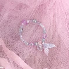 A gorgeous mermaid bracelet for the little one in your life! Made with beautiful purple, aqua and blue beads with a shimmering mermaid tail charm and personalised name initial. Ariel Bracelet, Mermaidcore Bracelet, Mermaid Beads Bracelet, Mermaid Tail Bracelet, Mermaid Phone, Glitter Jars, Mermaid Bracelet, Pink Mermaid, Little Ballerina