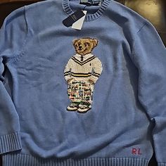 Light Blue Brand New Polo By Ralph Lauren Knit Sweater. Never Worn. With Tags. Designer Blue Sweater For Fall, Designer Blue Sweater For Winter, Designer Blue Long Sleeve Sweater, Designer Long Sleeve Blue Sweater, Designer Blue Tops For Winter, Polo Bear Sweater Outfit, Bear Sweater Outfit, Ralph Lauren Knit Sweater, Ralph Lauren Knit