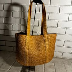 This Tote By Draper James Has Never Been Used. Double Handles. Fabric Lined In Navy Blue. Interior Zippered Pocket. Please See Pics For Measurements. Summer Tan Straw Bag With Braided Handles, Chic Yellow Straw Bag For Everyday Use, Casual Yellow Straw Bag For The Beach, Casual Yellow Straw Bag For Beach, Yellow Straw Shoulder Bag For Everyday Use, Tan Straw Bag With Braided Handles For Beach, Casual Straw Bag With Open Weave For Day Out, Gold Shoulder Bag For Everyday Summer Use, Casual Gold Straw Bag For Summer