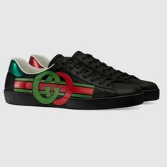 Gucci Men's Ace Sneakers With Signature Branded Interlocking G's Detail Chromatic Contrast Playfully Modernizes The Traditional Athleisure Sneaker With Interlocking Gg And Athletic Stripes As Part Of The Epilogue Collection. A Nod To The Founder Of The House. The Fashion House's Signature Green And Red Color Combo Recalls Heritage Themes Set Against An All-Black Silhouette. A Solid Rubber Heel Makes This Low-Top A Lasting Wardrobe Addition. Condition: Brand New Item; Never Worn Details: Contrast Gucci Slip On Sneakers, Red Color Combo, Gucci High Top Sneakers, Gucci High Tops, Beige Sneakers, Athleisure Sneakers, Tan Shoes, Black Silhouette, Gucci Leather