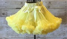 This Yellow Pettiskirt is so CUDDLY and PRECIOUS ! These are true newborn sizing with soft stretchy waists for the perfect fit. They are super soft and comfy for newborns. The listing is for one Bright Yellow Pettiskirt accented with a satin bow. Your adorable lil' one will turn heads with our beautiful soft,extra fluffy pettiskirt tutu's. Perfect for holidays, photo shoots, birthday parties, or special occasions. Our pettiskirts are made with the highest quality nylon/chiffon and a soft satin e Princess Belle Party, Yellow Tutu, Girls Dancewear, Kids Tutu, Your Adorable, Fluffy Skirt, Tulle Skirts, Market Ideas, Yellow Satin