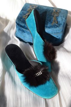 Rare and amazing pair of slippers from the 1950s, truly an iconic Old Hollywood artifact! Made of peacock blue velvet on the outside, black velvet on the inside. Still very soft, comfortable to wear. Featuring the softest and finest black fur, that very much looks like marabou feathers, and rhinestones. Straight from a golden age movie <3 Heel 2.1" / 5.5 cm CONDITION: very good overall - the inside is flawless, the external soles show minor signs of age; however please be aware of small yellow s Old Hollywood Bedroom, Slippers With Fur, Hollywood Bedroom, Hollywood Glamor, Marabou Feathers, Velvet Slippers, Bedroom Slippers, Old Hollywood Glamour, Vintage Velvet