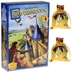 a game box with two pieces of gold in front of it and an image of a castle