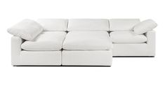 a large white couch with pillows on it's back and the seat facing outward