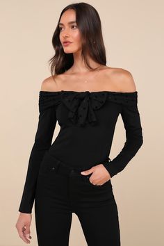 You'll be the center of attention in any room when you're wearing the Lulus Major Charisma Black Off-the-Shoulder Bow Long Sleeve Top! Stretchy ponte knit shapes this flattering top that has long sleeves and an off-the-shoulder neckline with a mesh-style overlay that has tonal velvet polka dots and forms a bow at the front. Fitted bodice continues down to a lightly cropped hem. Fit: This garment fits true to size. Length: Size medium measures 15" from top to bottom. Bust: Great for any cup size. Black Stretch Off-shoulder Top In Elastane, Black Stretch Elastane Off-shoulder Top, Black Off-shoulder One Shoulder Top, Fitted Cold Shoulder Off-shoulder Top For Fall, Fitted Cold Shoulder Top For Fall, Stretch Knit Top For Evening, Fitted Black Off-shoulder Top For Fall, Black Fitted Off-shoulder Top, Fitted Black Off-shoulder Top