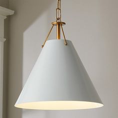 a white light hanging from a ceiling in a room