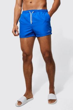 Make a bigger splash with our superlative swimwear. Who said you can't make a style statement while on the beach? Check out our brand new edit of men's swim shorts and choose from endless styles, available in both short and mid lengths. Go for bright colours if you don't want to get unnoticed while under the sun, or opt for graphic prints to stand out at your mate's pool party this summer. Complete with a plain t-shirt or vest and a pair of cool sliders for the perfect holiday getup. A Bigger Splash, Gym Joggers, Race Day Outfits, Gym Jacket, Suits Prom, Going Out Trousers, Going Out Shirts, Plus Size Suits, Gym Hoodie