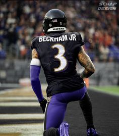 a football player sitting on the sidelines during a game