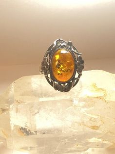 Amber ring floral sterling silver womenSize  8Weight   5.2g  Length     1"Width.       5/8"Thinnest part of band    1/8"Free Shipping & Free Postal Insurance Delivered in a Gift Box If you do not want the ring polished and want to leave the natural patina please let me know at the time of purchase as I do polish rings before I ship rings out. ThanksFree First Class shipping and postal insurance is included. If you want to upgrade to priority kindly pay an additional fee to do so.  This is re Nickel-free Amber Vintage Jewelry, Nickel-free Vintage Amber Jewelry, Vintage Nickel-free Amber Jewelry, Vintage Amber Nickel-free Jewelry, Vintage Oval Flower Ring Hallmarked, Antique Oval Flower Ring As A Gift, Antique Oval Flower Ring As Gift, Antique Oval Flower Ring Gift, Vintage Oval Hallmarked Flower Ring