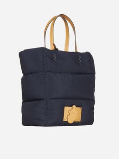 An idea of supersizing by way of padding characterizes the accessories from the 1 Moncler JW Anderson collection, and the concept is translated into this nylon tote bag. The spacious tote is trimmed with leather details. Composition: 100% nylon + 100% leather + 100% goose down (padding) Designer Aesthetic, Nylon Tote Bag, Moncler Logo, Moncler Genius, Nylon Tote Bags, Jw Anderson, Nylon Tote, Bags Tote, Gorgeous Bags