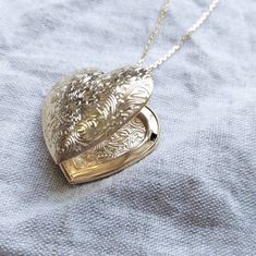 This romantic whimsical necklace is the perfect way to keep a couple of special photographs or messages close to your heart 💗 This 10k-gold plated locket sits on a 16 inch chain, perfect for layering or wearing on it's own. If a longer chain is needed, feel free to send me a DM! Locket measures 30mm in length x 25mm in width, and can fit two photos or messages inside.  🎁💎IF YOU WOULD LIKE A GIFT MESSAGE INSIDE 💎🎁 let me know when you place your order, and I can write something personalized Vintage Heart Necklace For Wedding On Mother's Day, Vintage Heart Necklace For Wedding And Mother's Day, Elegant Gold Locket Necklace For Wedding Gift, Personalized Open Heart Locket Necklace For Weddings, Double Heart Locket Necklace For Valentine's Day Wedding, Double Heart Locket Necklace For Wedding On Valentine's Day, Vintage Gold Necklaces For Wedding Gift, Double Heart Locket Necklace For Wedding And Valentine's Day, Double Heart Locket Necklace For Wedding And Mother's Day