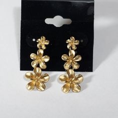 Beautiful three graduated flower earrings.  Solid 14k yellow gold , finished with diamond cut edges give sparkly surface of flower. They romantic lovely earring can be wonderful gift for your lovely person. Length of earrings 30mm , first flower 6 mm , second 10mm , third 12mm Weight 5.35 g Post earrings have back stopper butterfly . Your New earrings come in gift box with organza pouch  Any question about this jewelry contact with me, please. Many thanks and happy shopping, For finished jewelry Gold Elegant Flower Earrings With 3d Flowers, Elegant Gold Flower Earrings With 3d Details, Elegant Gold Jewelry With 3d Flowers, Formal Gold Flower Cluster Earrings, Gold Flower Cluster Earrings For Pierced Ears, Gold Drop Earrings With 3d Flowers, Gold 3d Flower Earrings For Formal Occasions, Gold Flower Cluster Earrings, Formal Gold Flower Earrings With 3d Details