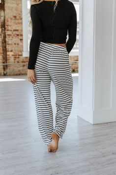 Introducing the Katelyn Striped Wide Leg Pants - the perfect blend of style and comfort! These pants feature a modern striped design and a wide leg cut that flatters your figure. Made with high-quality materials, these pants offer all-day comfort without compromising on style. Elevate your wardrobe with these versatile and chic pants. Model Info: Models are 5'7", Size 2, wearing smalls Material: 85% Polyester + 10%Cotton+ 5% Elastane Size Chart (INCH) Sizes Hip Inseam Trousers_Waist Outseam Bott Striped Wide Leg Trousers With Elastic Waistband, Striped Wide Leg Stretch Pants, Striped Stretch Wide Leg Pants, Chic Striped Bottoms With Elastic Waistband, Chic Striped Pants With Elastic Waistband, Striped Wide-leg Pants With Elastic Waistband, Striped Wide Leg Ankle-length Pants With Elastic Waistband, Striped Stretch Wide-leg Pants, Stretch Striped Pants For Loungewear