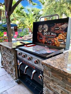 an outdoor bbq grill with food cooking on it