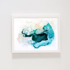 an abstract painting hangs on the wall