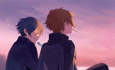 two young men standing next to each other in front of a pink sky with clouds