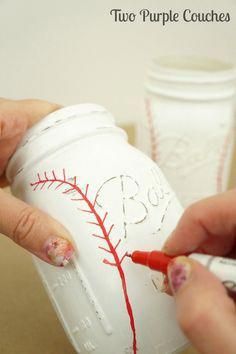 someone is drawing on a mason jar with red crayons and white paper cups