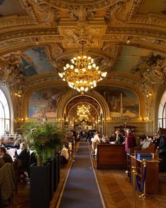 an ornately decorated dining hall with chandeliers