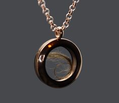 "This unisex human or pet hair locket is new to our collection of fill-at-home pieces. Your purchase includes the rose gold toned locket, gold toned chain, and does not require mailing the hair, ashes, flowers, sand, etc. It is composed of sturdy glass and rose gold toned stainless steel (hypoallergenic, scratch/tarnish resistant). The stainless steel chain is 32\" and can easily be worn shorter by threading the clasp through a different link. If screwed properly, the locket is air and watertigh Luxury Black Jewelry For Memorial, Cremation Jewelry Spirit Piece Memorials, Memorial Necklace Ring, Hair Jewelry Dog, Luxury Spiritual Jewelry For Memorial, Pet Ashes Keepsake, Hair Locket Keepsake, Hair Memorial Jewelry, Hair Locket