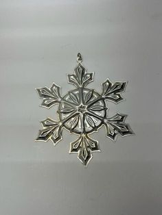 a snowflake ornament hanging from the ceiling