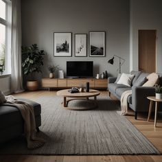 a living room filled with furniture and a flat screen tv on top of a wooden table