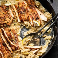 chicken and pasta in a skillet with a spoon