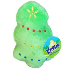 a green stuffed animal with yellow stars on it's chest