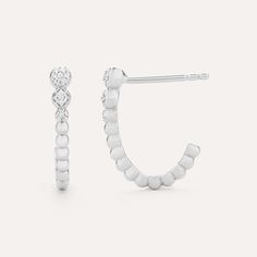 SKU# E-10933 Diamond Weight 0.03cts Earrings Height 16.40 mm Width 3.30 mm Thickness 2.60 mm. Post back closure Finish 14k gold plated sterling silver or in sterling silver. Avoid contact with anything containing derivatives of alcohol.