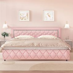 a bed with pink upholstered headboard and foot board in a light colored room