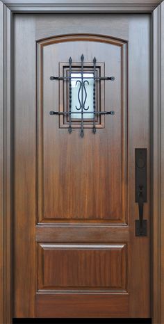 a close up of a wooden door with metal bars on the front and side panels