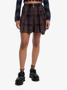 Combine edgy vibes with scholarly sophistication with this pleated skirt! Perfect for the dark academia look  this black and purple skirt features removable suspender straps  plus a zipper on the front with O-ring detailing.Please note: Style is fitted with no stretch; size up for a looser fit.65% polyester; 35% rayonWash cold; dry flatNon-stretch materialLength: 32''ImportedListed in junior sizesModel is 5'9''Model wears size Small Edgy Pleated Bottoms For Fall, Edgy Pleated Skirt For School, Punk Pleated Skirt For School, Punk Style Pleated Skirt For School, Gothic Pleated Mini Skirt For Fall, Punk Pleated Mini Skirt For Fall, Hot Topic Skirts, Academia Look, Dark Academia Look