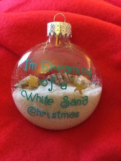 a christmas ornament that says i'm dreaming of a white sand christmas