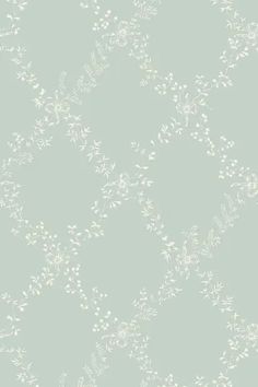 a light blue wallpaper with white flowers on it