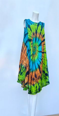 This summer, treat yourself to one (or more!) of our dresses. Loose, comfortable, and perfect for everyday! HELPFUL DETAILS: ‣ Comfortable, smooth, and flowy ‣ Perfect for shopping, picnics, parties, bonfires, walks, lounging, gifts, etc. ‣ SUPER flowy which is perfect as a swimsuit/beach coverup ‣ Bright and vivid colors + CUTE TIE DYE SPIRAL DESIGN! ‣ Comfortable, Smooth, Flowy Rayon ‣ ONE SIZE FITS MOST! (very VERY flowy and spacious) ‣ Length: 44 inches ‣ Bust (Chest): 44 inches ‣ Perfect as Multicolor Cotton Sleeveless Summer Dress, Summer Cotton Multicolor Maxi Dress, Orange Cotton Sundress For The Beach, Free Size Cotton Maxi Dress For Summer, Green Sundress For Summer, Multicolor Cotton Sundress For Beach Season, Multicolor Cotton Sundress For Summer, Green Cotton Sundress For Summer, Green Sleeveless Summer Beach Dress