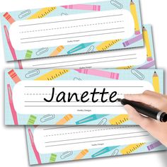 two name tags with pencils and crayons on them, one has the word janette