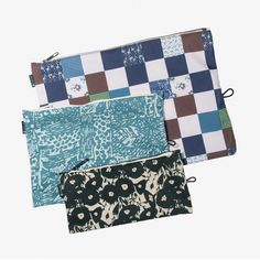 four zippered pouchs with different patterns on them