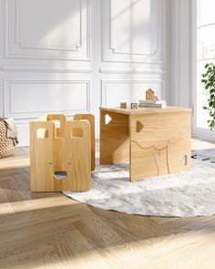 two wooden boxes sitting on the floor next to each other in front of a white wall