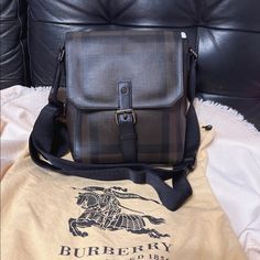 Burberry Men Vaughan Smoked Check Coated Small Brown Canvas Messenger Bag 8"L X 3.5"W X 10"H Designer Coated Canvas Bags For Formal Occasions, Designer Brown Satchel For Business Trips, Designer Brown Bags For Business Trips, Designer Crossbody Shoulder Bag For Business, Designer Coated Canvas Bags For Business Trips, Designer Business Satchel Shoulder Bag, High-end Coated Canvas Satchel For Business, Designer Business Crossbody Satchel, Designer Crossbody Satchel For Business