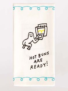 a tea towel with an image of a toaster and the words hot buns are ready