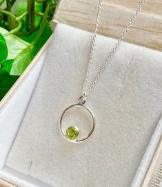 "Sweet and simple Sterling necklace with lovely Peridot ! The faceted, bright apple green Peridot is nestled in Sterling silver bezel with an open back. This Peridot necklace is a perfect gift for someone born in August since Peridot is their birthstone. The Sterling silver chain is adjustable from 14-22 inches. Simply glide the chain through the silver bead at the clasp to your desired length. Also appropriate for a young girl. The necklace comes in a standard gift box. FOR GIFT GIVING: ** Sati Box For Gift, Sterling Necklace, Peridot Jewelry, Peridot Pendant, Peridot Necklace, August Birthstone, Sterling Necklaces, Green Peridot, Gift Pouch